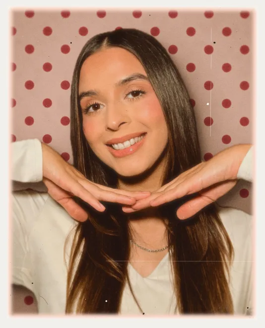The print with a pink polka-dot backdrop