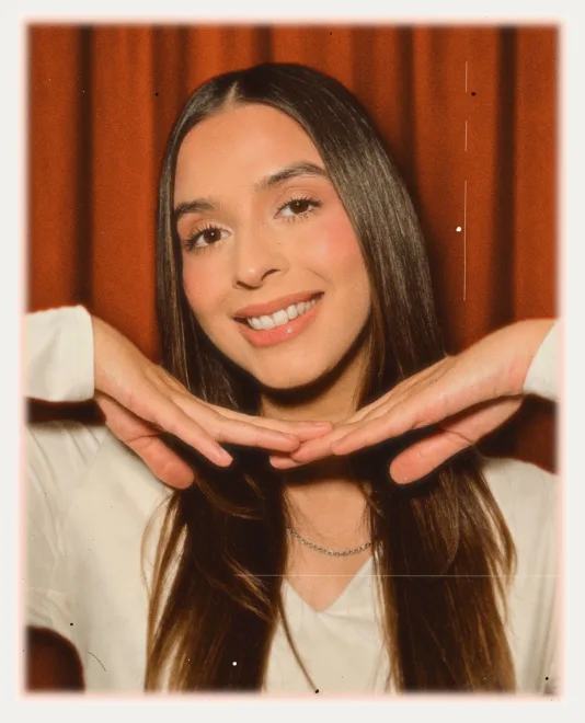 The print with a red curtain backdrop